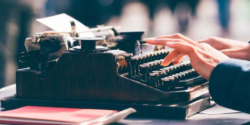 A close-up view of a writer checking manuscripts