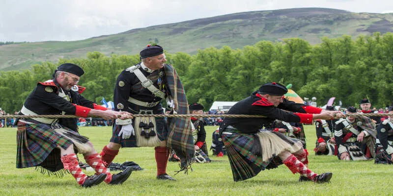 A master piper playing traditional tunes outdoors