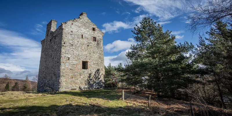 An ancient iron sword resting on castle stonework
