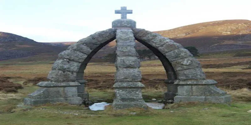 An ancient stone bridge crossing a rushing river