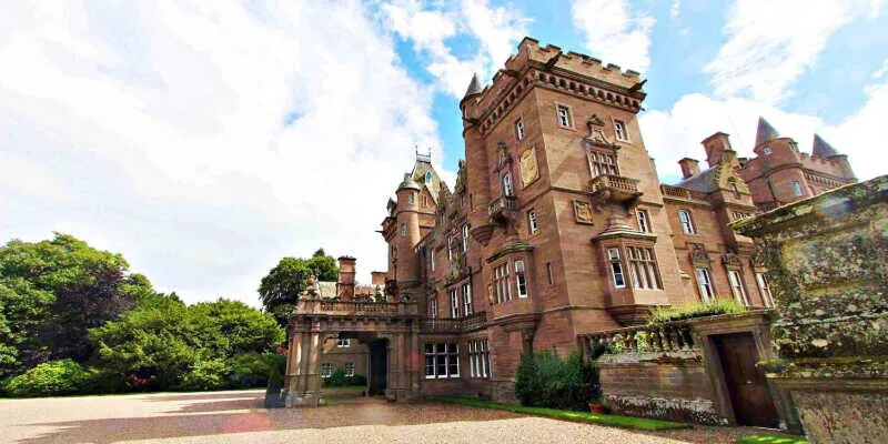 The ancient tower house stands amid green mountains