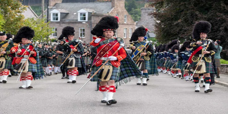 Tourists visiting a traditional highland gatheringTourists visiting a traditional highland gathering
