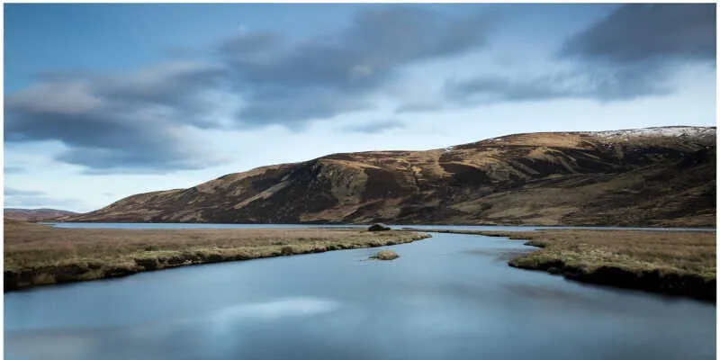 Weathered stone ruins of an old highland cottage