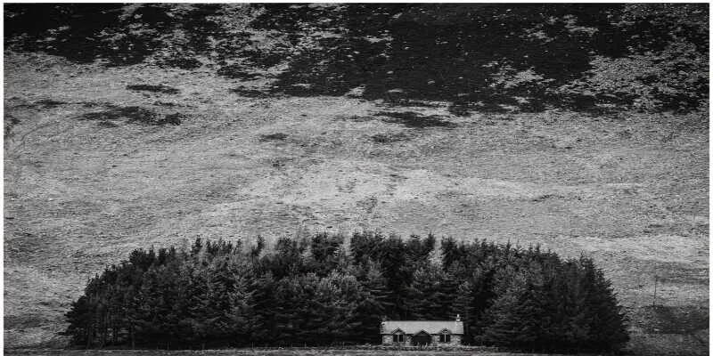 Weathered stone ruins of an old highland cottage